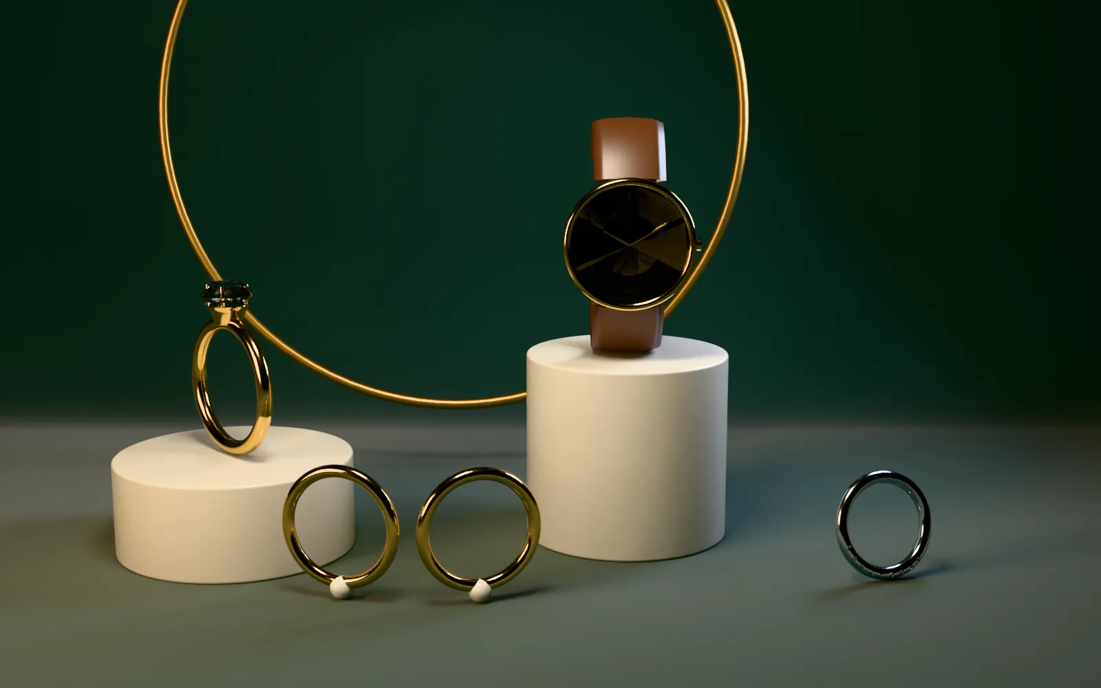 Rings and a watch on ivory plinths against green velvet
